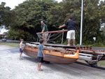 rigging sails on the double canoe